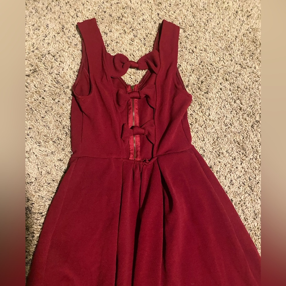 Burgundy dress with cute bow cutouts!